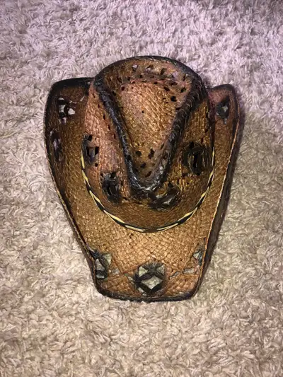 Add a touch of Western flair to your wardrobe with this used Western Express straw cowboy hat, sized...