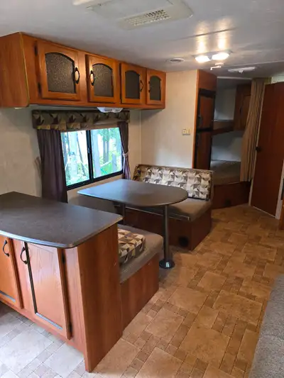 Used in very good condition. Queen bed in front and two bunk beds in rear. Outside power owning and...