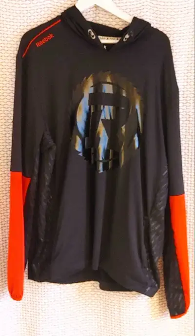 Size XL men's Reebok Ottawa Redblacks black and red hoodie. Mint condition. Smoke free home pick up...