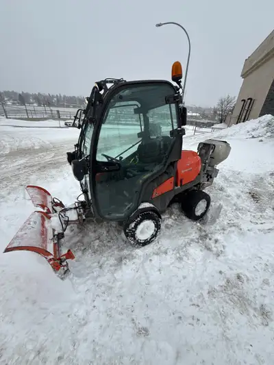 1150 hours Strong Diesel Engine Enclosed Cab Comes with plow and sweeper attachments AND salt spread...