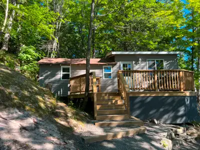 The lakefront Rockhaven cottage has three bedrooms, sleeps six people, three piece washroom, kitchen...