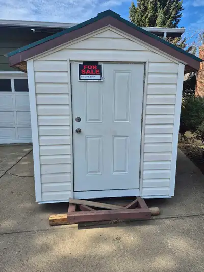 6' x 8' , 2"x4" construction. Metal exterior door, vinyl siding ,Metal roof, inside shelves. Deliver...