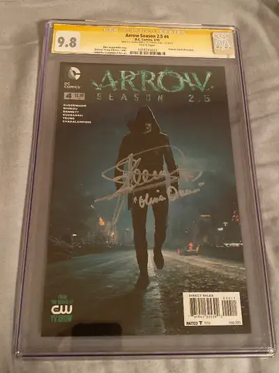 Take a look at pics. Signed by actor Stephen Amell. Inscribe “Oliver Queen”. Very rare. Graded 9.8 b...