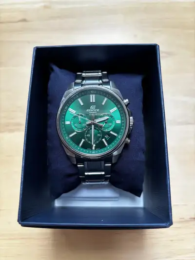This is a Casio Edifice Chronograph watch with a striking green face and stainless steel band, perfe...