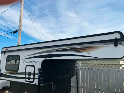 Slide in truck camper, 2017 Palomino backback SS-550. This slide-in truck camper has never been used...