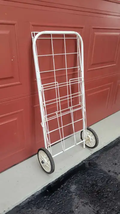 Sturdy, white metal rolling grocery, newspaper drlivery cart-$10 Conveniently folds flat for compact...