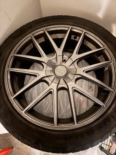 A set of 4 Winter tires and Rims for sale. TOUREN rims- Matte Gunmetal 20 x 8.5J ET20 275/40 R20 Min...