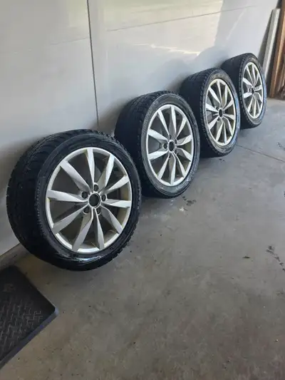 Very lightly used Bridgestone Blizzak WS 80 tires Size 225/45R17 on OEM VW Rims. These were used ver...
