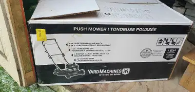 New Yard Machines push lawn mower. Has 132cc Powermore OHV engine. Features 2-in-1 side discharge an...