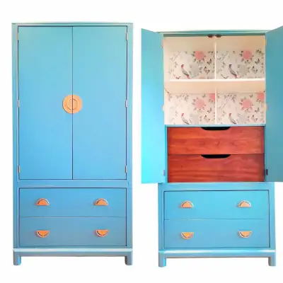 Gorgeous solid wood Chinoiserie style armoire finished in blue, white and wood with beautiful wallpa...
