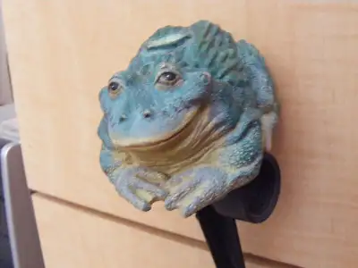 for sale frog sprinkler made of what seems to be plaster, its heavy has a black stake on the bottom,...