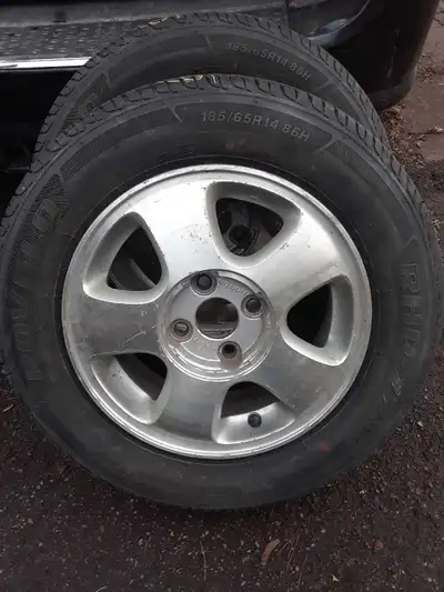 See photos No center caps for rims 185 65 14 Snow + mud tires Tires have 8/32" & 6/32" tread depth 4...