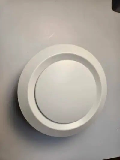 This is an 8-inch round duct cover, ideal for enhancing your ventilation system. This item is in use...