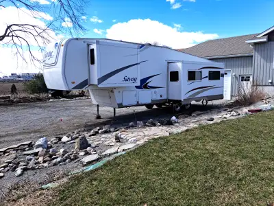 Used 5th wheel. Everything works. Has a soft spot on roof and needs new floor under bed slide. No vi...