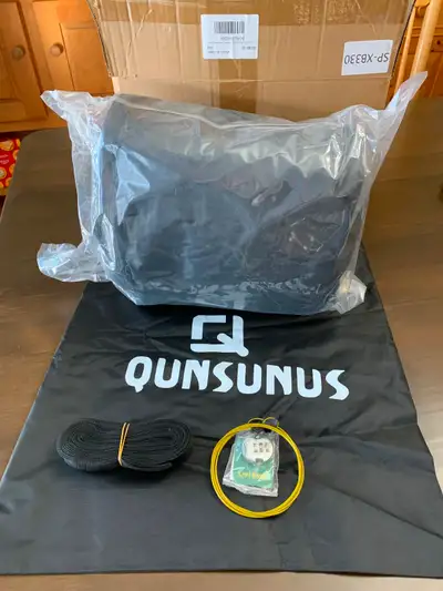 Black Toyota truck cover fits up to 21 feet 2 inches. Unopened.