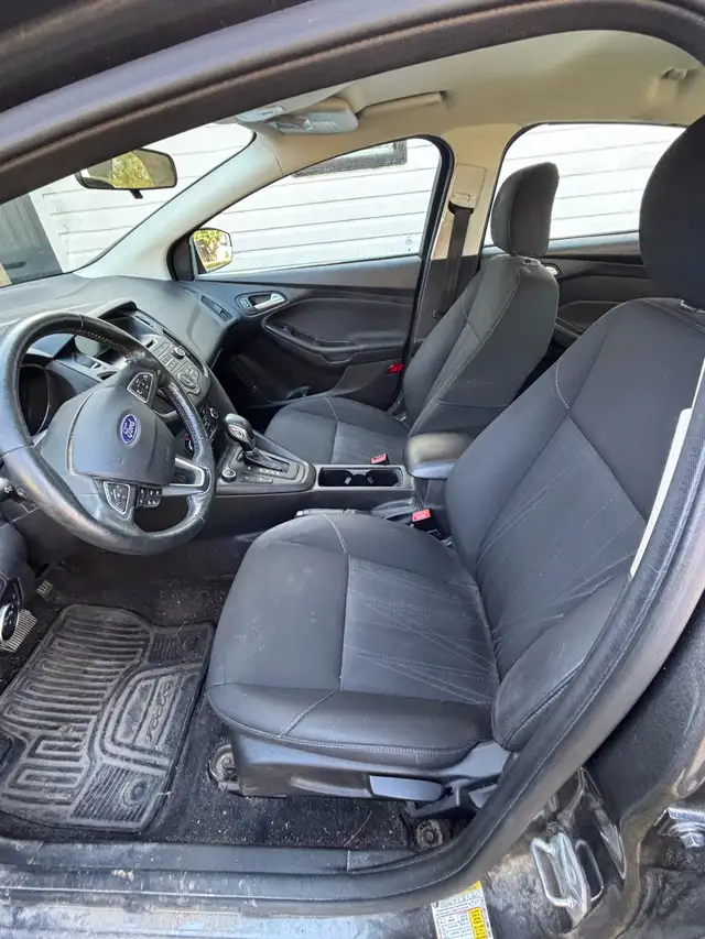 Ford Focus it has 4 studded winter tires on rims goes with it in Cars & Trucks in Cape Breton - Image 4