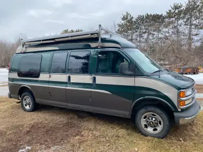 2001 chev express high roof V8, 350 engine Queen size bed cut to fit sideways. 5,8” 12 volt fridge 1...