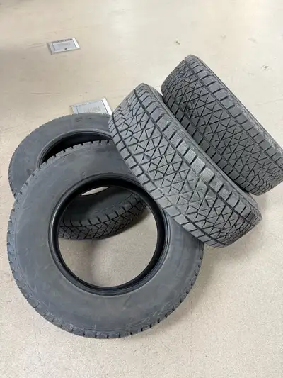 I am selling a set of four Bridgestone BLIZZAK DM-V2 tires, size 255/70R18, perfect for winter drivi...