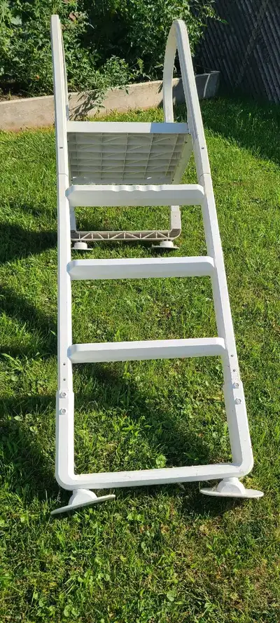 This is a used swimming pool ladder, ready to help you get in and out of your above-ground pool safe...