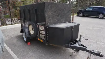 4x8 plywood floor 2inch ball toolbox at front tailgate slides off upwards spare tire racks on each s...