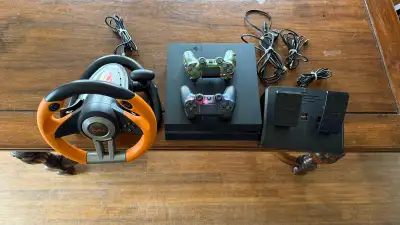 PS4 800 Gb, 2 controllers & racing wheel, View more