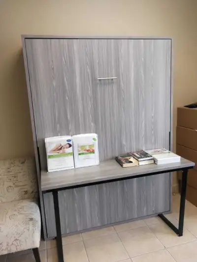 This brand new Murphy bed is designed for both queen and double size mattresses, making it a versati...