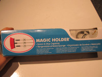 BNIB Magic holder. Broom & mop organizer.