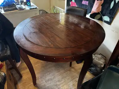 Table it’s still in great condition but chairs just need to be reposted 42 inches in diameter