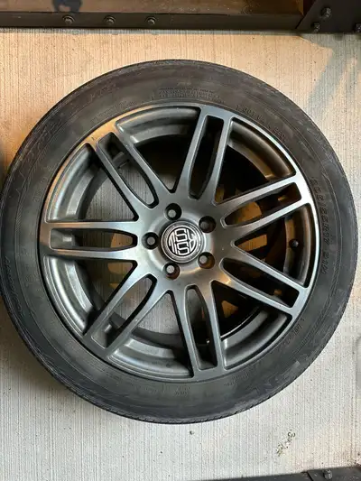 For sale is a set of four 18-inch alloy rims paired with tires, previously used but still in service...