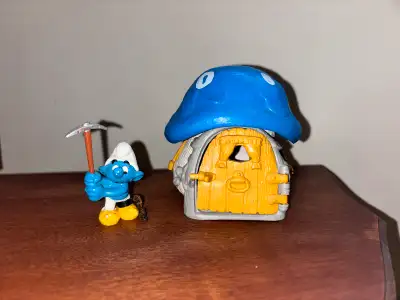 Add a touch of nostalgia to your collection with this vintage Smurf and Smurf House set! These colle...