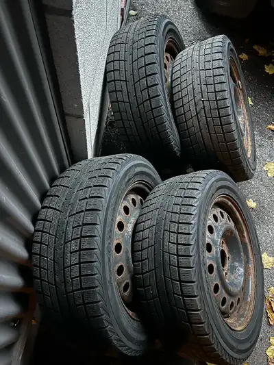 4 used Yokohama ice guard iG52c winter tires with steelies. Came off 2013 civic. About 2 winters lef...