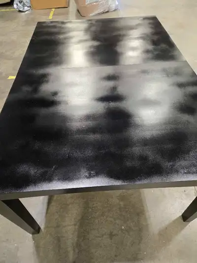 This used black table is sturdy and functional, ready for a new home. It shows signs of wear, which...