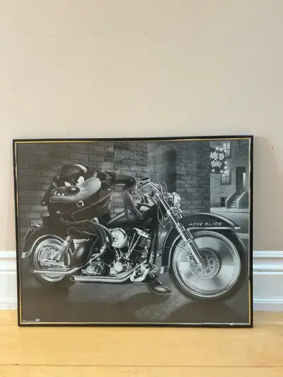 This is black and white framed photo of Tasmanian Devil on Harley Davidson. The wild carecture from...