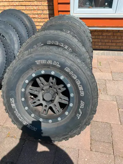 M+S LT28575R16 tires. On nice rims. Need to be cleaned up. Fills the wheel well on your YJ/JK etc, R...