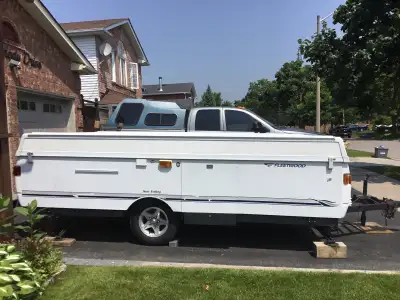 25 ft Fleetwood Tent Trailer Inside stove and sink never used Awning and screened enclosure never us...