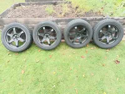Ironman 225/45R17 snow tires on black aluminum rims. Bolt pattern 5X100. Came off 2011 Subaru Imprez...