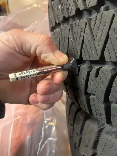 I am selling a set of four Bridgestone winter tires mounted on black steel rims, size 235/45/R17. Th...