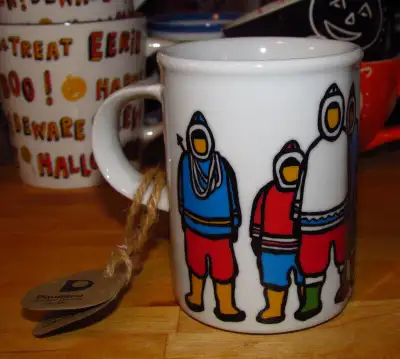 A great looking cup with seven Eskimos / Inuit. The cup measures approximately 4” high with a diamet...