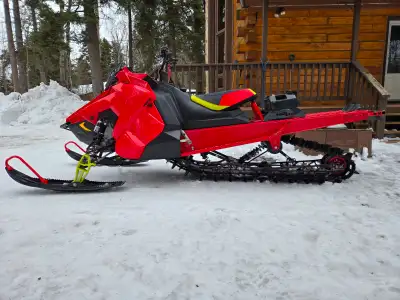 2021 Polaris 850 SKS 155 2.6 with after market Khaos skid. Very fun machine, runs well. Ice age Khao...