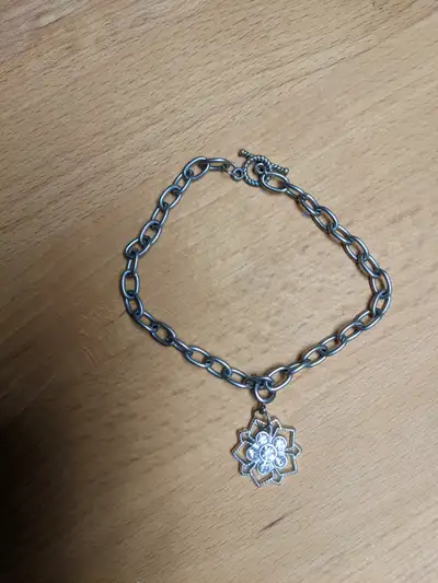 One bracelet with a charm. $5 One green beaded bracelet with bead hook clasp. $5 One chunky bead bra...