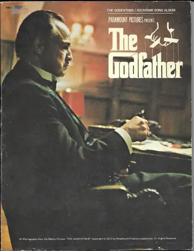 Title: THE GODFATHER Souvenir Song Album Description: Includes a 24-page section of colour and black...