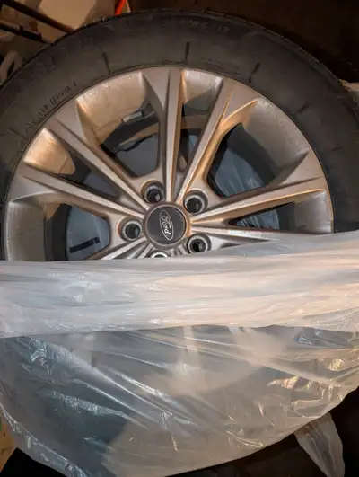 Set of 4 Bridgestone WeatherPeak Tires 235/55R17 bought in April and taken off in October. Excellent...