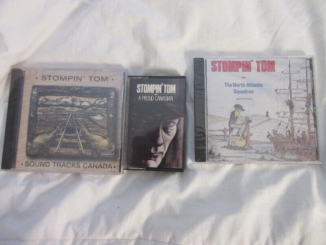 Lot:  2 New in plastic CD Stompin Tom, 1 used cassette tape in CDs, DVDs & Blu-ray in Timmins