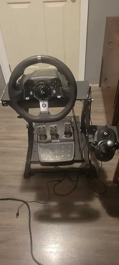 Xbox Logitech Steering Wheel w/ frame, pedals, and stick shifter, View more