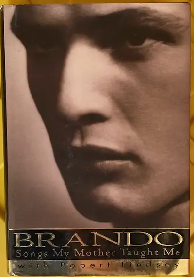 For sale is a hard cover copy of Marlon Brando's autobiography, Songs My Mother Taught Me. An honest...