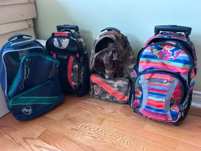 Backpacks - Rolling with Pull Out Handle Have a few backpacks that also have the pull out rolling ha...