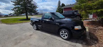 2001 Ford F-150 SVT Lightning — supercharged 5.4L V8 and a solid set of performance upgrades. Key De...