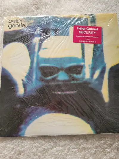Offering a vintage Peter Gabriel "Security" vinyl record in good as new condition, perfect for colle...