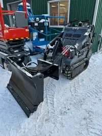 Mini skid steers with snow blades for rent