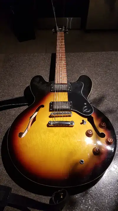 2 year old Epiphone electric guitar; 6 string copy of a Gibson 335; in excellent condition and easy...